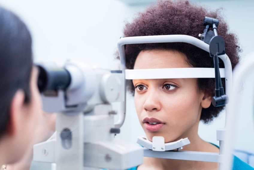 Woman undergoing eye exam