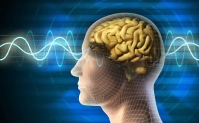 Conceptual drawing of a human head showing the brain, with electric waves going through the head
