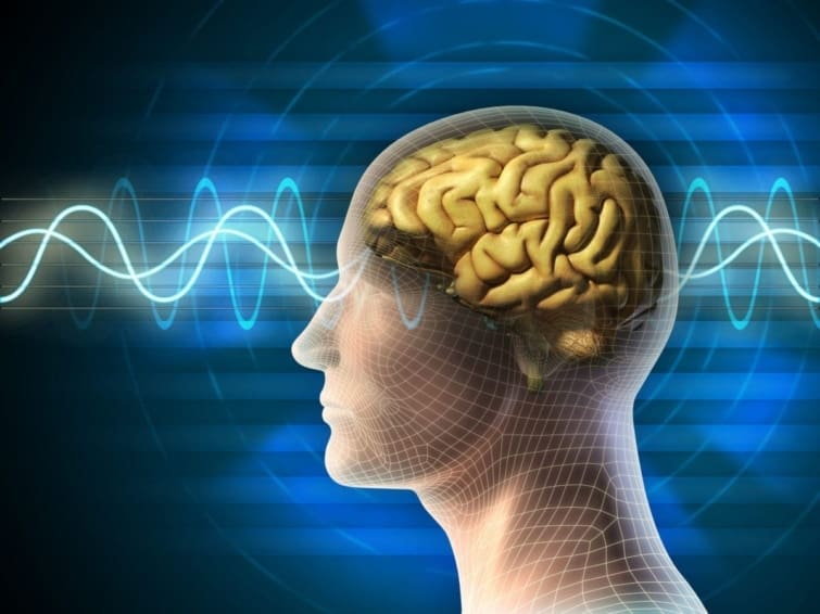 Conceptual drawing of a human head showing the brain, with electric waves going through the head