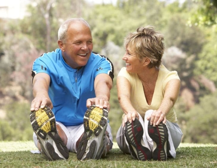 Senior couple exercising in the park