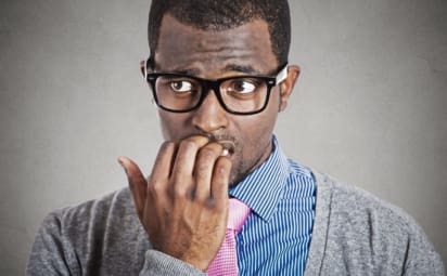 Anxious young business man looking away