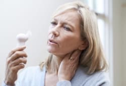 Mature woman experiencing a hot flash from menopause