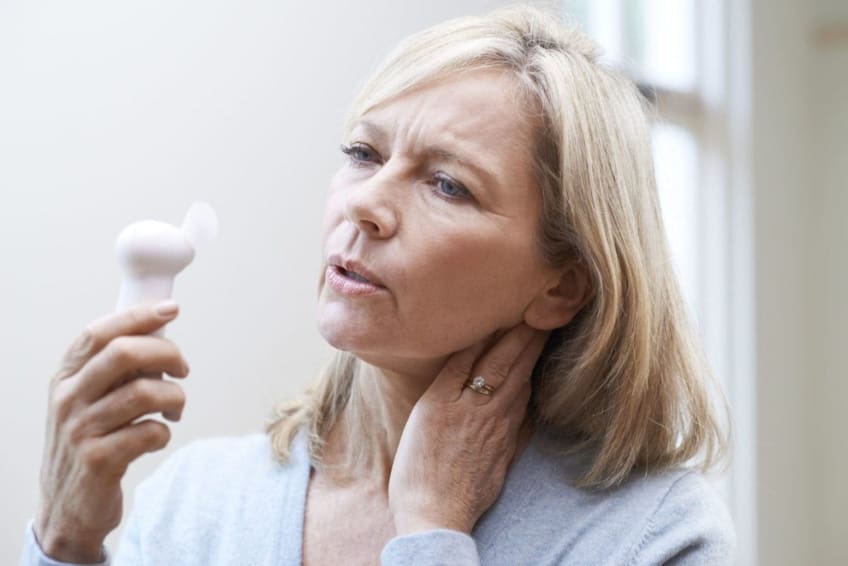 Mature woman experiencing a hot flash from menopause