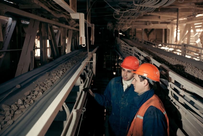 Miners surveying rocks