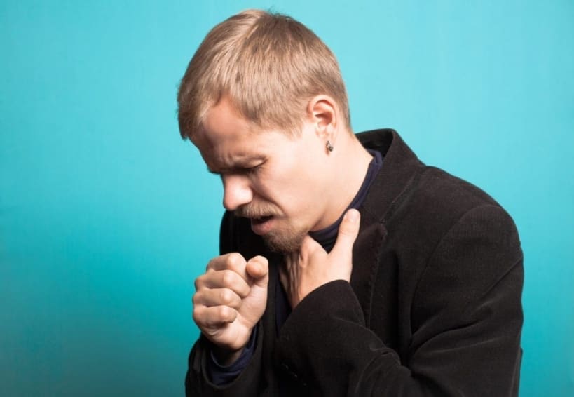 A man coughs into his hand. Whooping cough is a respiratory infection. It is also known as pertussis. Whooping cough is highly contagious and is most harmful to babies.