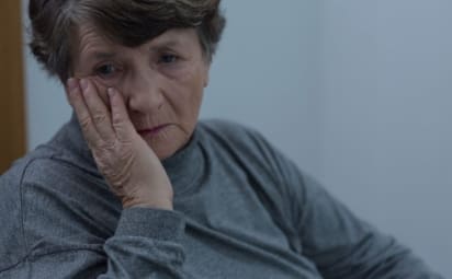 Portrait of older woman suffering for depression