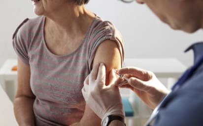 An older woman gets a flu shot. There are a lot of myths surrounding the flu.